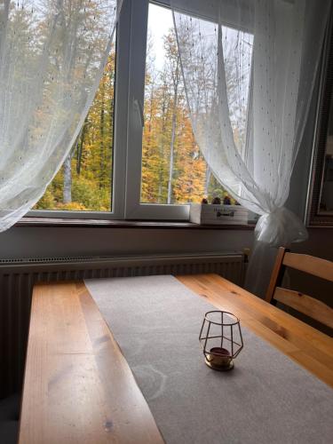 a bowl on a table in front of a window at Vila Orizont Straja in Straja