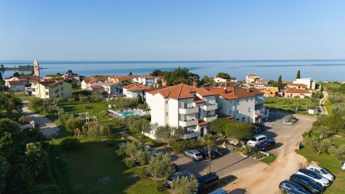 an aerial view of a town with cars parked in a parking lot at Villa Badi in Umag
