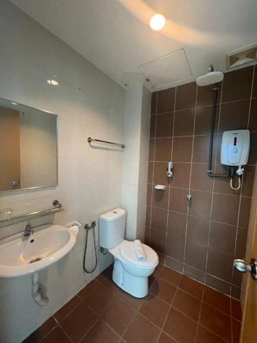 a bathroom with a toilet and a sink at Hotel Zamburger Bangsar (Previously Koptown Hotel Bangsar) in Kuala Lumpur