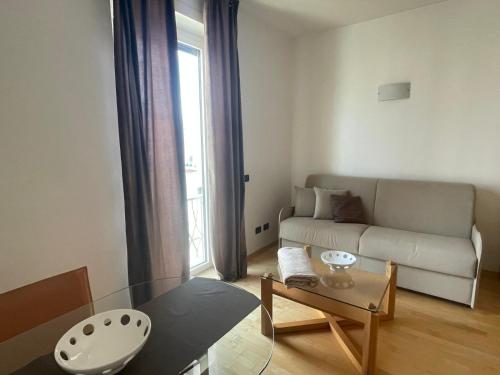 a living room with a couch and a table at garibaldi citta' in Trapani