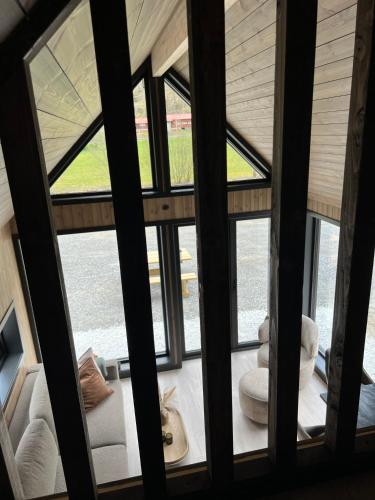 a view from the inside of a house with windows at Flåm Minisuite in Aurland