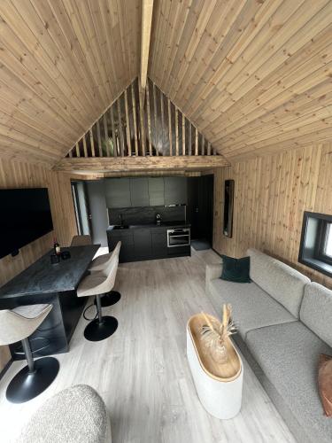 a living room with a couch and a table at Flåm Minisuite in Aurland