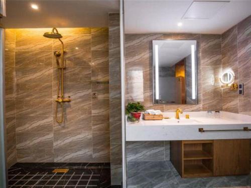 two pictures of a bathroom with a sink and a shower at James Joyce Coffetel·Kaifeng Drum Tower in Kaifeng