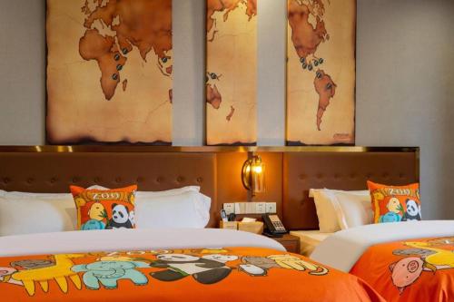 a hotel room with two beds and a map of the world at James Joyce Coffetel·Lijiang Old Town Centeral in Lijiang
