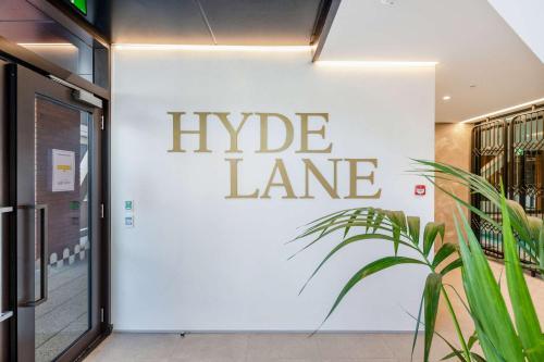 a white wall with a sign that reads hype lane at WLG CBD 1BR - Luxe Hyde Lane Stay with Amenities in Wellington