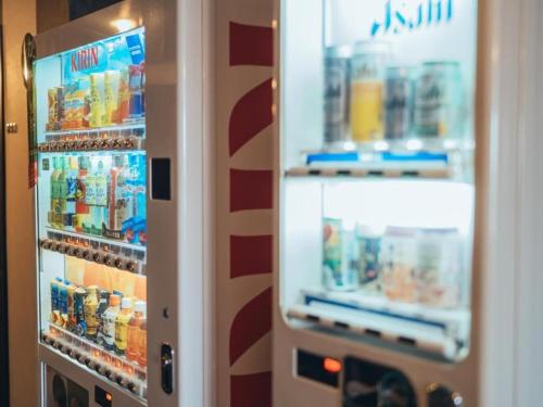 a refrigerator filled with lots of food and drinks at Hotel Areaone Miyazaki in Miyazaki