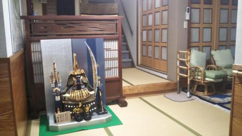 a small room with a table and a chair at Kikunoya Ryokan in Kanazawa