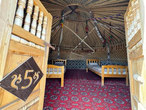 a room with two benches in a yurt at GOLDEN Safari YURT CAMP in Elʼtay