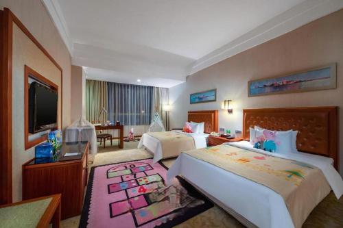 Postel nebo postele na pokoji v ubytování Yihao International Hotel