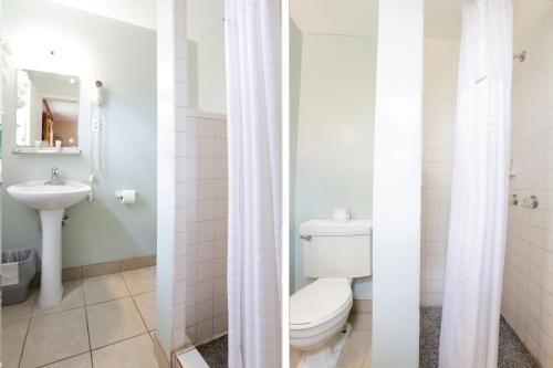 a bathroom with a toilet and a sink at Relax Inn By OYO Natural Bridge I-81 in Natural Bridge