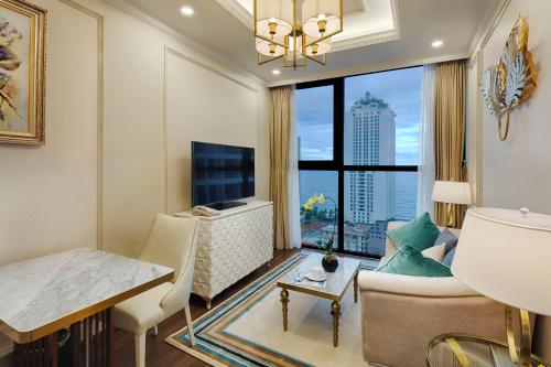 a living room with a view of a city at Meliá Vinpearl Nha Trang Empire in Nha Trang