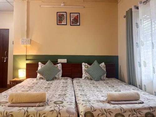 Postel nebo postele na pokoji v ubytování Mulaqat Homestay