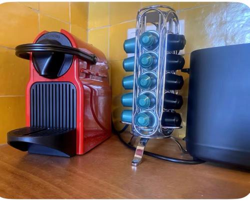 a hair dryer next to a heater on a table at charming studio in Amsterdam-Noord in Amsterdam