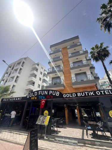 a building with a sign that reads cold fun pub at Gold Butik Otel in Marmaris