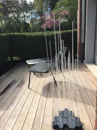 a chair and a table on a wooden deck at Le Domaine des Loups in Souchez
