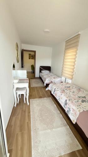 Postel nebo postele na pokoji v ubytování MANONI APARTMANI