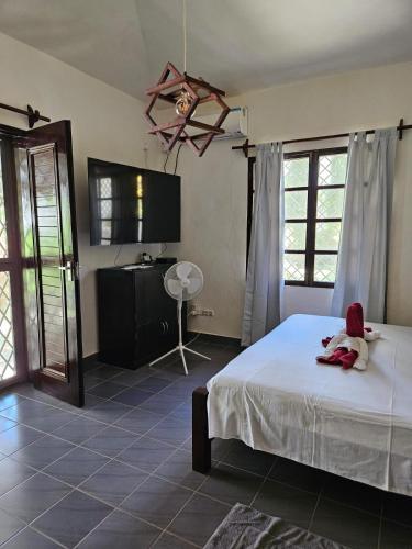 Postel nebo postele na pokoji v ubytování Diani beach luxury Villa Green Paradise with Private pool