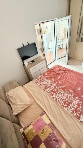 Postel nebo postele na pokoji v ubytování MANONI APARTMANI