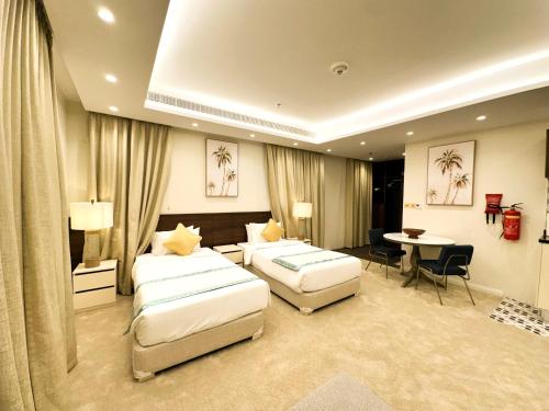 Postel nebo postele na pokoji v ubytování Hotel Majestic Inn - Madinat Khalifa