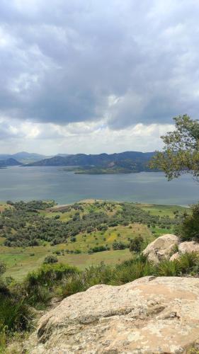 a view of a large body of water from a mountain at Ferme Dar Aicha green Bellouta in Bellouta