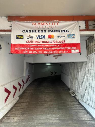 a tunnel with a sign for a classless parking at Alamis City Kuala Lumpur - Formerly EDC Hotel Kuala Lumpur in Kuala Lumpur