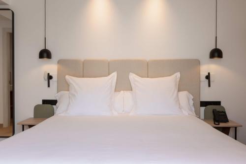 Ένα ή περισσότερα κρεβάτια σε δωμάτιο στο Hostal Marí