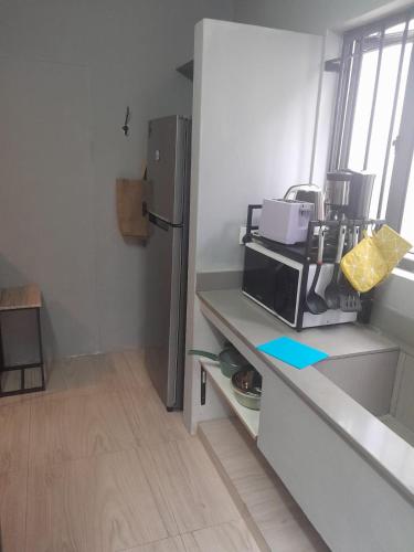 Kuchyň nebo kuchyňský kout v ubytování One-bedroom beach apartment, aircon,pool,WIFI