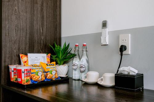 a table with food and drinks on top of it at Phu Quy Vibes Villa - sát biển cạnh bãi tắm in Cù Lao Thu