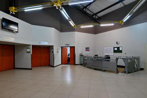 an empty room with a large room with a lobby at Holiday Inn - Bulawayo by IHG in Bulawayo