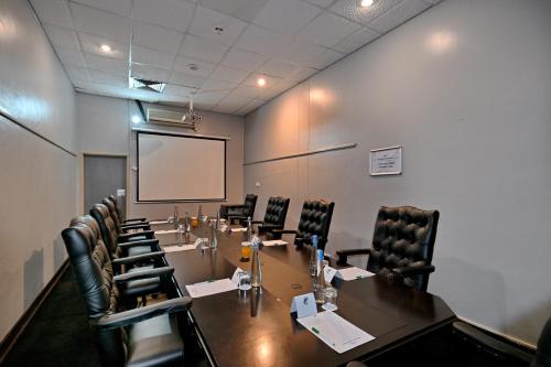 a conference room with a long table and chairs at Holiday Inn - Bulawayo by IHG in Bulawayo