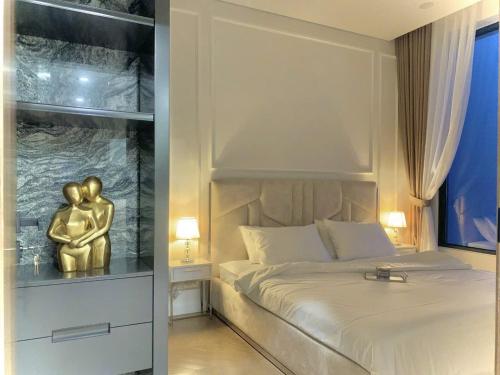 Ένα ή περισσότερα κρεβάτια σε δωμάτιο στο 1BR appartment at Lumiere Riverside, city view free pool