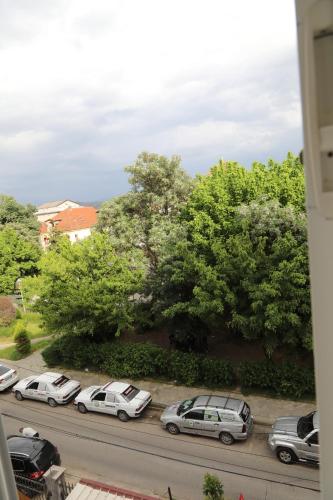 a group of cars parked in a parking lot at Rozafa Guest Room Center in Shkodër