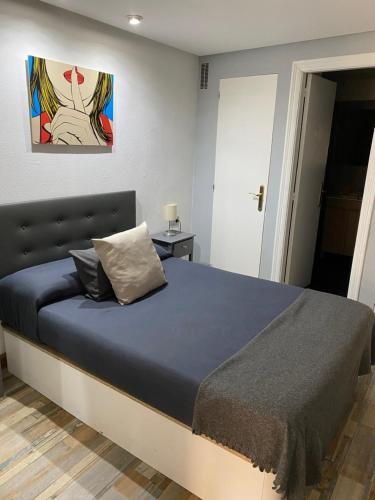 Apartamentos Viva Leónにあるベッド