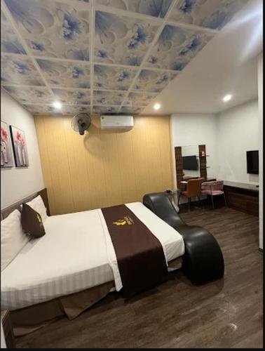 En eller flere senge i et værelse på One Villa Hotel 1