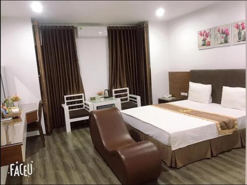 En eller flere senge i et værelse på One Villa Hotel 1