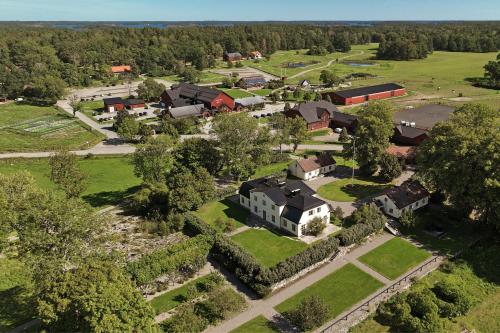 an aerial view of a village with houses and trees at Siggesta Gård in Värmdö