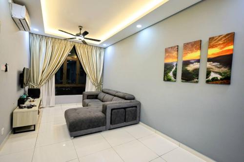 a living room with a couch and a ceiling fan at D'summit by Comfort Places Management in Johor Bahru