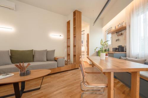 a living room with a table and a couch at Koukaki Cityscape in Athens