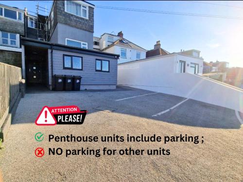 a parking lot with no parking for other units at OYO Shore Surf Lodge in Newquay