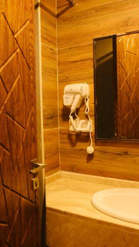 a bathroom with a toilet and a sink at Ailana Hotel in Aqaba
