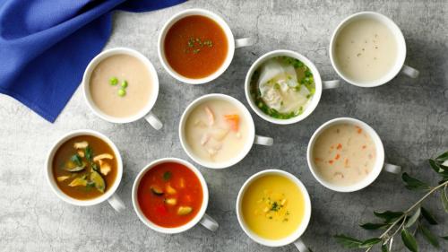 a group of bowls of soup on a table at Toyoko Inn Ueda Ekimae in Ueda