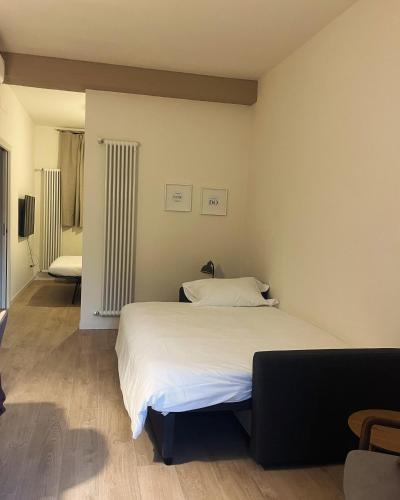 a bedroom with a large white bed in it at AL 31 Bg in Bergamo