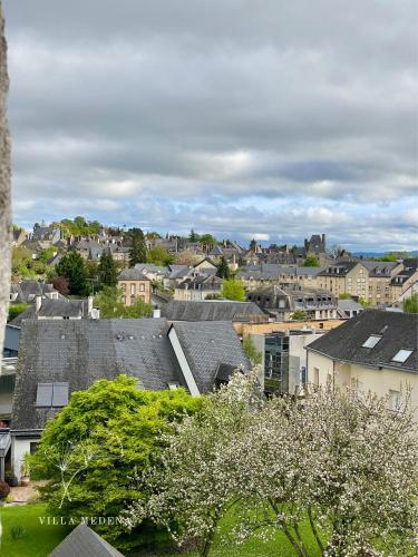 a view of a city with houses and trees at Appartement Villa Medena - Classé 3 étoiles in Mayenne
