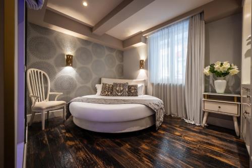 Ένα ή περισσότερα κρεβάτια σε δωμάτιο στο HT6 Hotel Roma