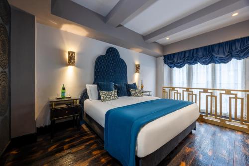 Ένα ή περισσότερα κρεβάτια σε δωμάτιο στο HT6 Hotel Roma
