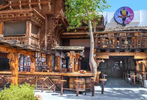 a wooden building with a table in front of it at JAZ Sharm Dreams in Sharm El Sheikh