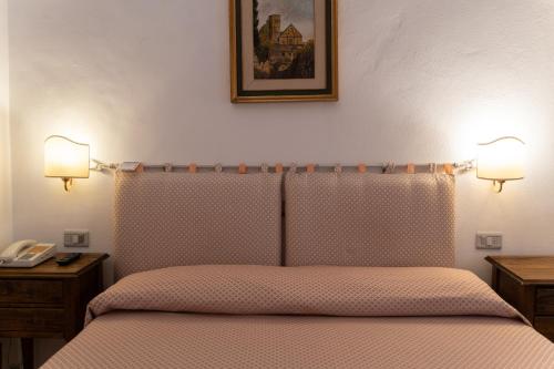 Una cama o camas en una habitación de Hotel Belvedere