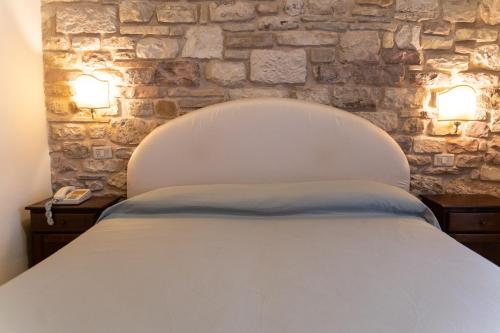 Una cama o camas en una habitación de Hotel Belvedere