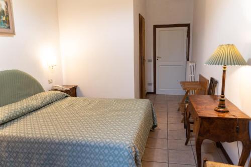Una cama o camas en una habitación de Hotel Belvedere