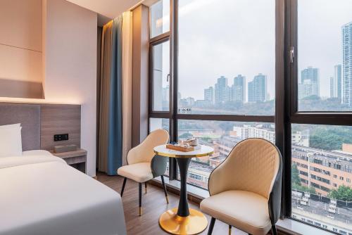 Postel nebo postele na pokoji v ubytování ChongQing Could Hotel 重庆云禧酒店